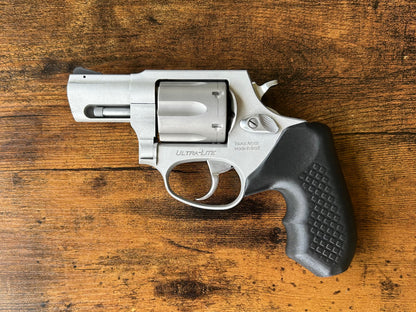 "Zero-compromise" concealed carry grips for the Taurus 856 line. Before, wheelgun folks had to choose between shooting comfort (rubber grips) or carry comfort (wood or G10 grips). Recoil Rider revolver grips provide both, featuring the recoil absorption of rubber grips with the snag-free comfort of wooden grips. Plus, they reduce the weight for easier carry and improve the grip angle of your Taurus 856 for a more natural point-of-aim. If you're carrying your revolver AIWB or in the pocket, these utilitarian