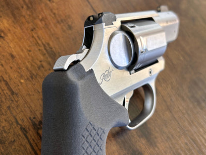 "Zero-compromise" concealed carry grips for the Kimber K6XS and K6S revolver line. Before, wheelgun folks had to choose between shooting comfort (rubber grips) or carry comfort (wood or G10 grips). Recoil Rider revolver grips provide both, featuring the recoil absorption of rubber grips with the snag-free comfort of wooden grips. Plus, they reduce the weight for easier carry. If you're carrying your revolver AIWB or in the pocket, these utilitarian grips will provide a superior shooting and CCW experience. 
