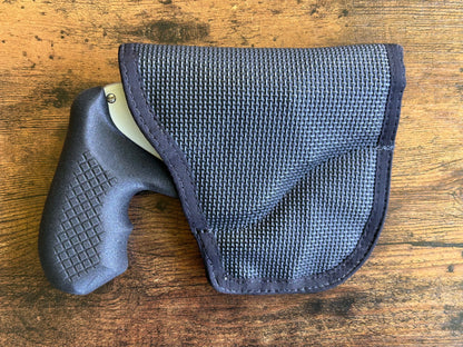 Internal hammer j-frame (model 642/442) and DeSantis Gunhide holster for pocket carry.